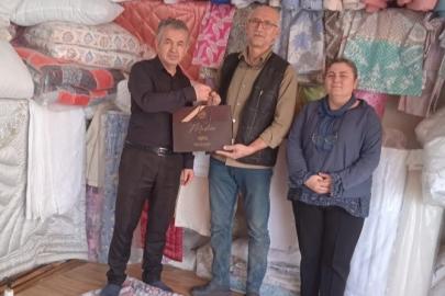 Tavşanlı’da 40 yılı aşkın esnafa ziyaret ve hediye
