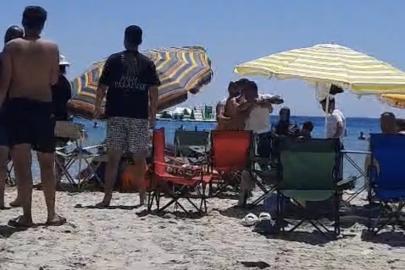 Çeşme’de plajda ‘Şemsiyeni açamazsın’ kavgası