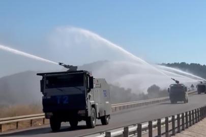 Kontrol altına alınan orman yangınında peş peşe sıralanan TOMA’ların müdahalesi
