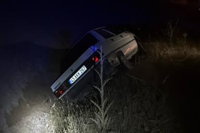Kontrolden çıkan otomobil araziye savruldu