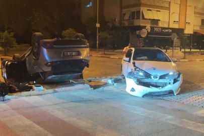 Çarpışmanın etkisiyle ters dönen otomobilden hafif yaralı çıktılar
